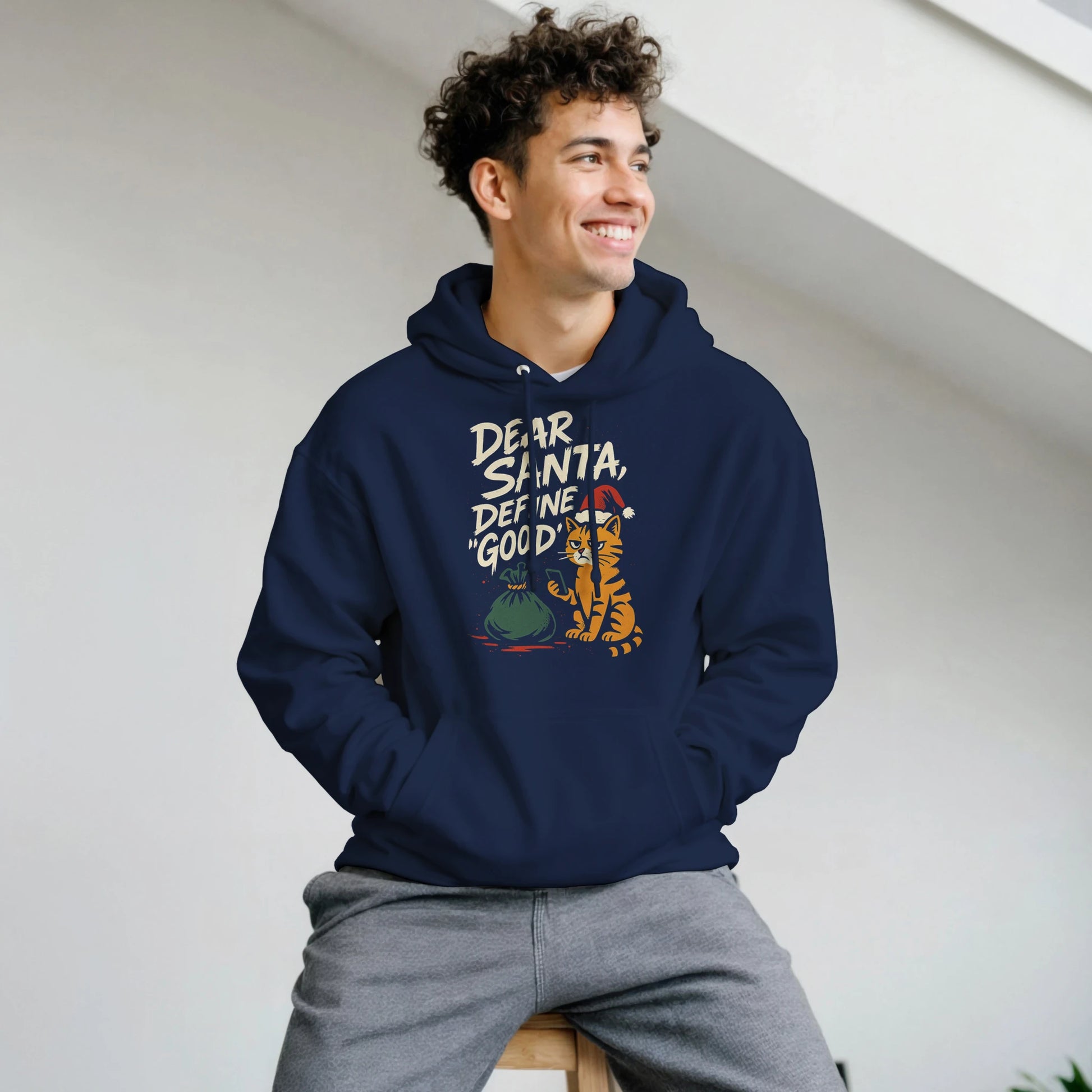 Person wearing the "Dear Santa, Define Good" hoodie, showing casual holiday streetwear fit.