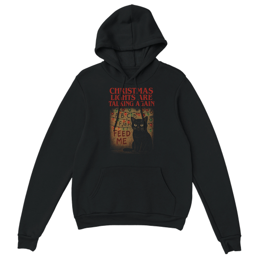 Black hoodie with a black cat surrounded by tangled Christmas lights and the text "Christmas Lights Are Talking Again". Sarcastic holiday streetwear.