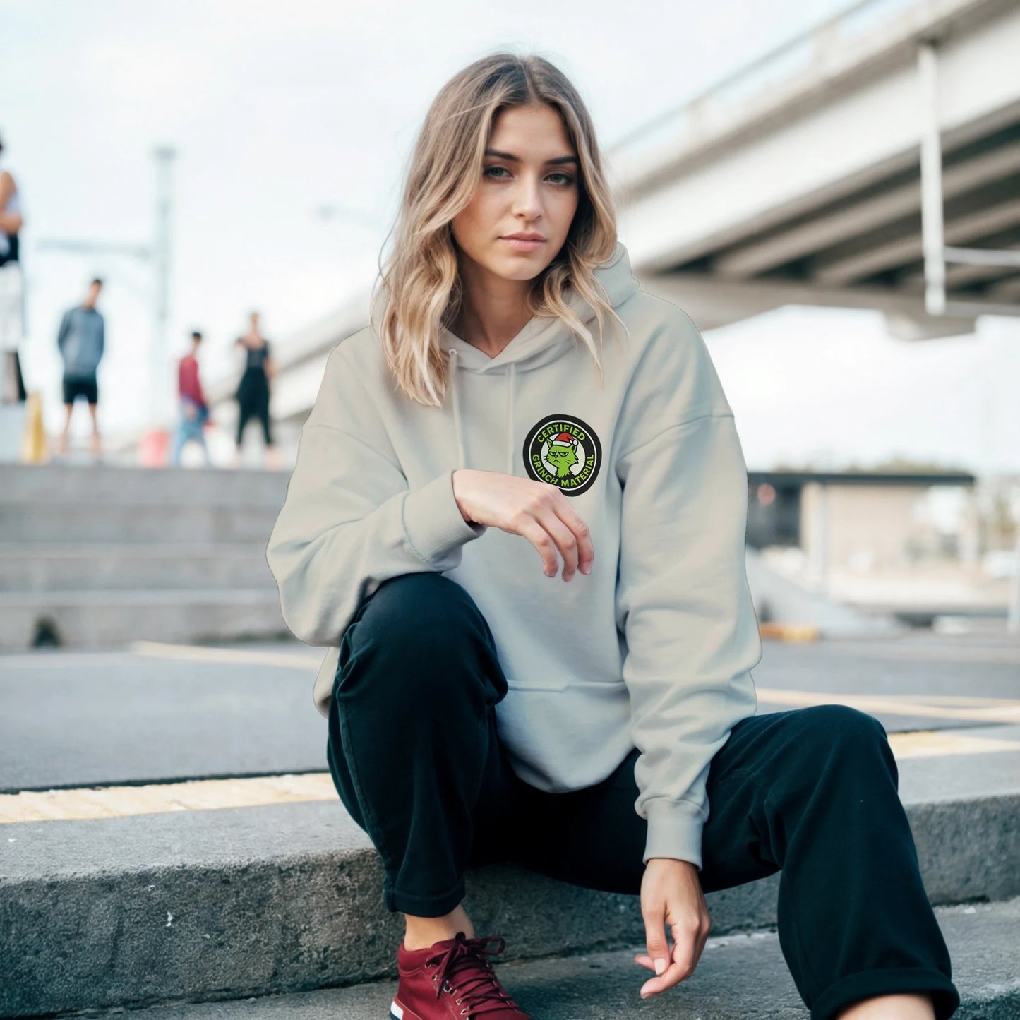 Person wearing the Certified Grinch Mate hoodie, showing relaxed cozy fit and sarcastic holiday streetwear style.