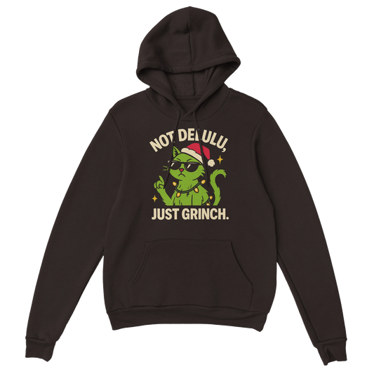 Brown hoodie featuring a green grinch-style cat wearing a Santa hat with the text "Not Delulu, Just Grinch". Sarcastic holiday streetwear.
